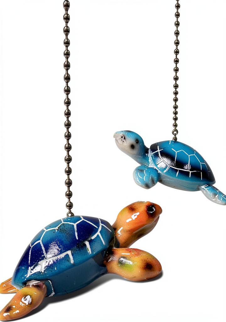 Nautical turtle ceiling fan pull chain ornament installed on a white ceiling fan